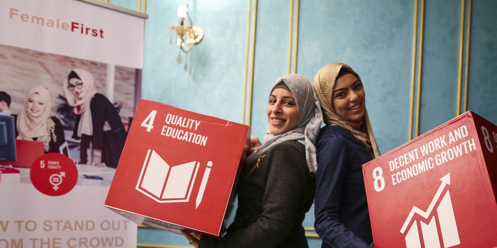 Girls hold SDG 8 & 4