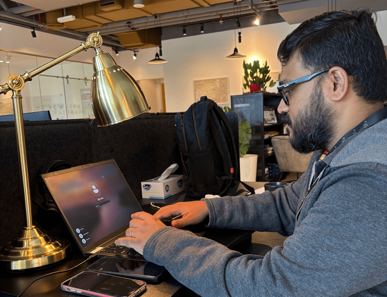 CTG Rapid Recruitment and Deployment team leader Ajit Alex working on a laptop.