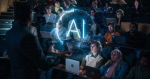 A lecturer gestures to a hologram with the letters “AI” while delivering a lecture to a diverse group of college students. 